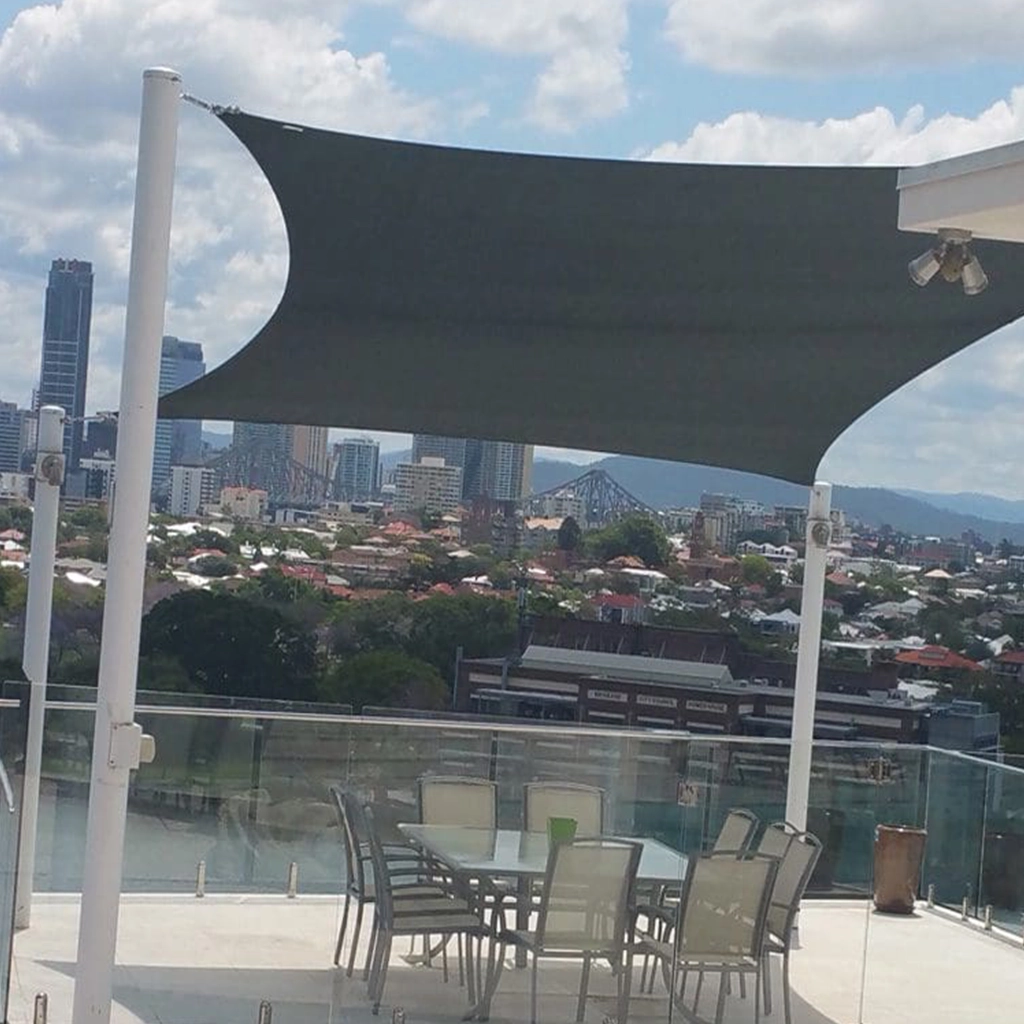 4 point shade sail 6m wide with variable lengths installed over backyard patio