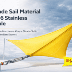 shade sail material with 316 stainless steel cable hardware holding a tensioned yellow outdoor shade sail during storm conditions